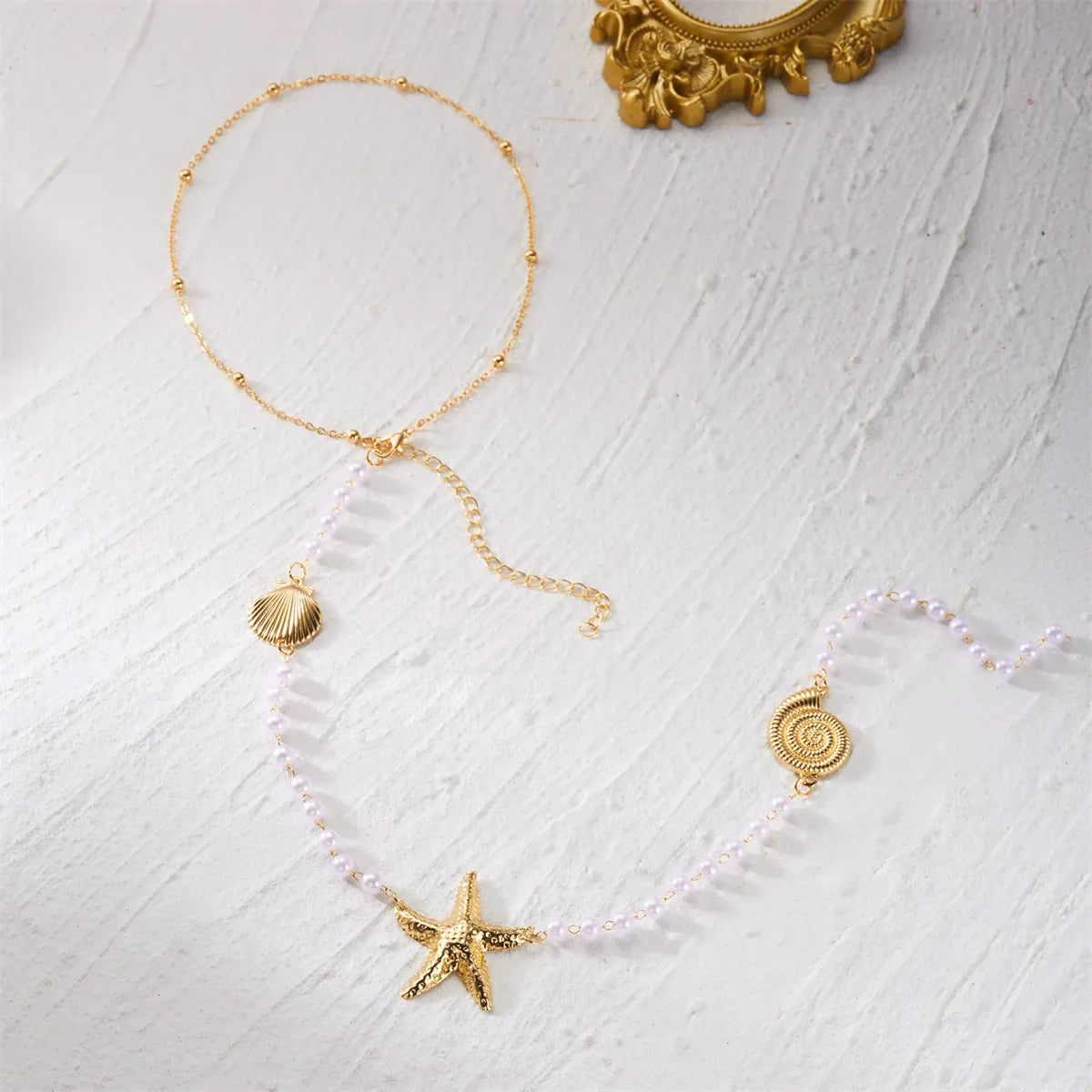 Collier de Dos Ete Perle