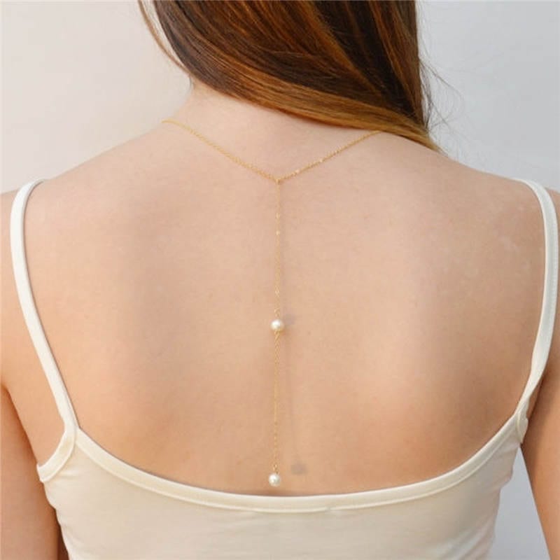backless dress with necklace Amazon.com: Pearl Back Drop Necklace for Backless Dress Back Necklace Wedding Bridal Long Pearl Drop Back Chain Body Jewelry (Gold) : Clothing, Shoes & Jewelry