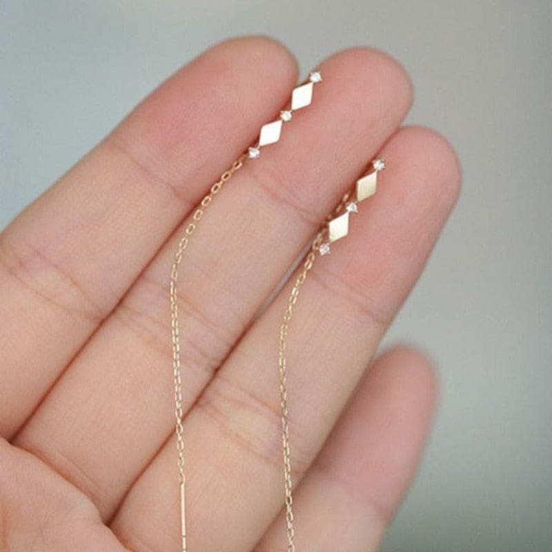 Boucle d&#39;oreille chaine traversante losange doré