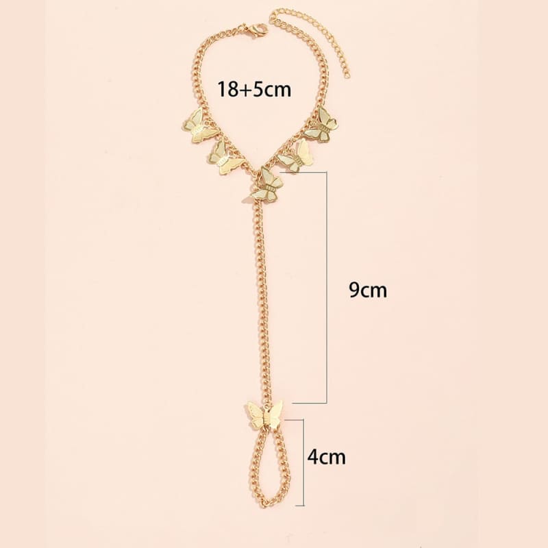 Chaine de main en or avec papillon